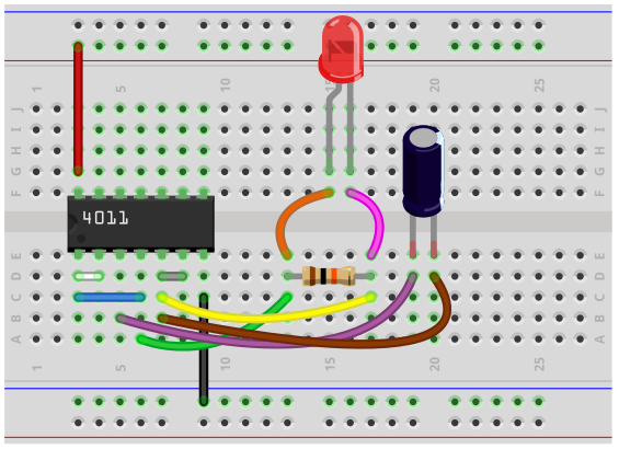 Astable multivibrator breadboard circuit with a 4011 NAND gate chip