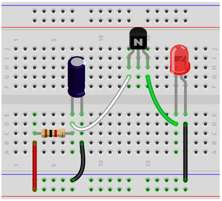 Relaxation oscillator breadboard circuit with a transistor